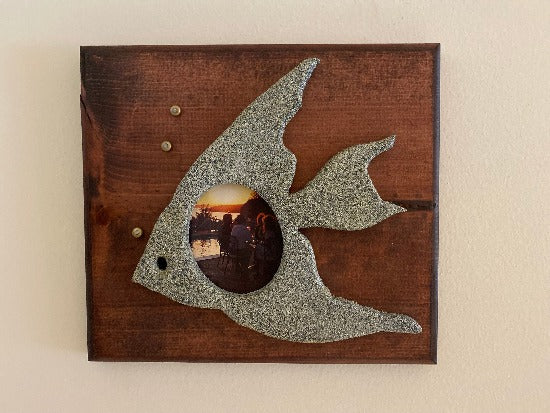  A great gift for the lake home or cabin. Housewarming gift for your neighbor's lake home. A fish, attached with a picture 9 1/2" H x 10 1/2" W x 2" D, textured paint, acrylic paint, 3 beads,  wood backing, mahogany stained with self leveling hanger. Borgmanns Creations