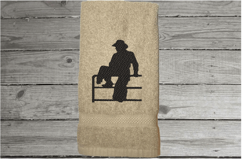 Cowboy on fence beige hand towel - birthday gift for dad for his den or work area - mom can display it in the bathroom or kitchen - embroidered housewarming gift -  gift for the cowboy in your life - wedding shower gift for the western couple - Borgmanns Creations - 1