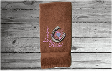 Load image into Gallery viewer, Brown hand towel - home decor western theme - embroidered with &quot;Live Love Ride&quot; - custom gift for your kitchen or bath decor -  unique birthday gift , gift for the cowgirl or cowboy in your life - premium soft and absorbent hand towel for a housewarming gift - Borgmann Creations - 2
