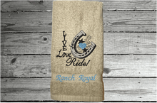 Load image into Gallery viewer, Beige hand towel - home decor western theme - embroidered with &quot;Live Love Ride&quot; - custom gift for your kitchen or bath decor - unique birthday gift , gift for the cowgirl or cowboy in your life - premium soft and absorbent hand towel for a housewarming gift - Borgmann Creations
