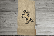 Load image into Gallery viewer, Beige bathroom hand towel - horse design western home decor - personalized horse lovers gift - embroidered hand towel - perfect western farmhouse design - gift for mom - bathroom or kitchen decor - Borgmanns Creations 3
