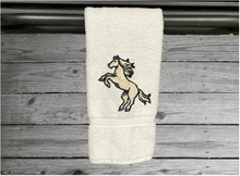 Load image into Gallery viewer, White bathroom hand towel - horse design western home decor - personalized horse lovers gift - embroidered hand towel - perfect western farmhouse design - gift for mom - bathroom or kitchen decor - Borgmanns Creations 5
