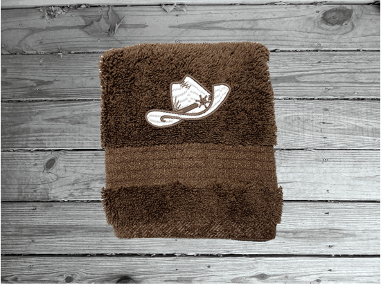 Brown washcloth, cowboy hat and boots is the perfect design for that farmhouse decor. This Luxury western theme towel set 3 towels 1 bath towel 27"x55", 1 hand towel 16"x28", 1 wash cloth 13" x 13". You can personalize the towel set with a name and an initial on the wash cloth or just the designs. Borgmanns Creations