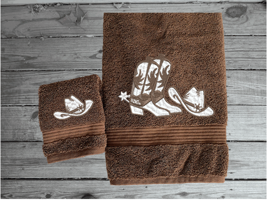 Brown bath towel and washcloh, cowboy hat and boots is the perfect design for that farmhouse decor. This Luxury western theme towel set 3 towels 1 bath towel 27"x55", 1 hand towel 16"x28", 1 wash cloth 13" x 13". You can personalize the towel set with a name and an initial on the wash cloth or just the designs. Borgmanns Creations