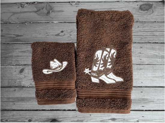 Brown hand towel and washcloth , cowboy hat and boots is the perfect design for that farmhouse decor. This Luxury western theme towel set 3 towels 1 bath towel 27"x55", 1 hand towel 16"x 27", 1 wash cloth 13" x 13". You can personalize the towel set with a name and an initial on the wash cloth or just the designs. Borgmanns Creations