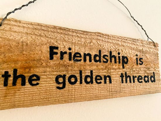 Wood sign wall hanging quotes "Friendship is the golden thread" hand painted on a cedar reclaimed fence panel, hung by wire, 11" x 4", would be a unique one of a kind gift. The natural wood color will go with any room. A gift for Mother's Day, Father's Day, 4th of July Memorial Day, etc. - Borgmanns Creations 