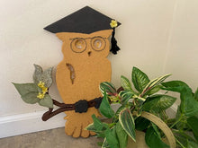 Load image into Gallery viewer, Yellow owl with black grad hat - wire for glasses - sitting on limb with flowers - wood sculpture wall hanging - baby shower nursery gift - Borgmanns Creations
