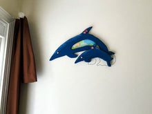 Load image into Gallery viewer, Wood wall art this wood sculpture of a porpoise, 1/2&quot;  MDF board, layered wood, hand painted, wire, flowers,  material, hanger on back, 12&quot; H x 18&quot; W x 1/2&quot; D, for that baby shower gift. Also great for a shelf sitter or even leaning against a wall at floor level. One of a kind baby shower gift - Borgmanns Creations 
