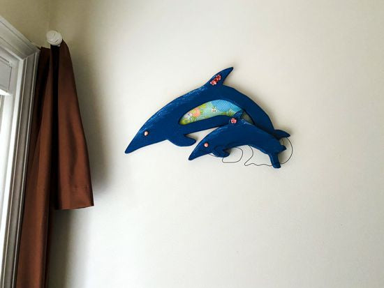 Wood wall art this wood sculpture of a porpoise, 1/2