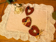 Load image into Gallery viewer, 3 Hearts - Wood Wall Hanging - 2 Hearts Have Open Centers - Hung By Wire  And  Connected By Wire - With Small Flowers and Raffia to Finish It Off -Borgmanns Creations
