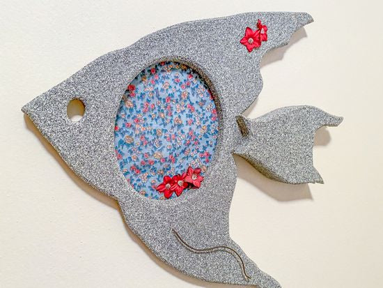 Wood wall art wall hanging, this wood sculpture of a fish is perfect for the nautical bathroom decor for that lake house decor. 1/2 MDF board, layered wood, hand painted, with wire, material, flowers, and hook on the back, 12" H x 13" W x 1" D - Borgmanns Creations 
