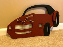 Load image into Gallery viewer, Wood wall art, wall sculpture of a red sports car, 1/2&quot; MDF board, layered wood, hand painted, laser cut words (Beep Beep), wire, material for grill, hubcaps, head lights, 10&quot; H x 17&quot; W x 1/2&quot; D, gift for dad,  son or friend who are interested in cars. Den decor or bedroom decor - Borgmanns Creations 
