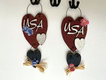 Load image into Gallery viewer, Wood wallart &quot;USA&quot; laser cut Luan wood, wire attaches 2 pieces, acrylic paint, glued together, flowers and raffia to complete the wall art, 10&quot; x 4&quot; including wire hanger, wall art will add to your home decor for the holidays, kitchen, living room, den or hallway. Perfect summer and 4th of July decoration - Borgmanns Creations 
