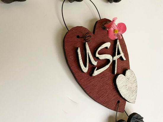 Wood wallart "USA" laser cut Luan wood, wire attaches 2 pieces, acrylic paint, glued together, flowers and raffia to complete the wall art, 10" x 4" including wire hanger, wall art will add to your home decor for the holidays, kitchen, living room, den or hallway. Perfect summer and 4th of July decoration - Borgmanns Creations 
