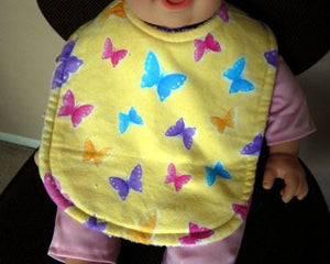 This bib and burp cloth set of butterflies with yellow background is made of flannel top and terry cloth backing, bib 9" from neck to bottom- 8" wide with sticky fasteners,  burp cloth is 16" x 8" to keep the baby dry from those frequent spills. Makes a great new mom gift, new born gift or baby shower gift.  Custom gift for a toddler - Borgmanns Creations - 1