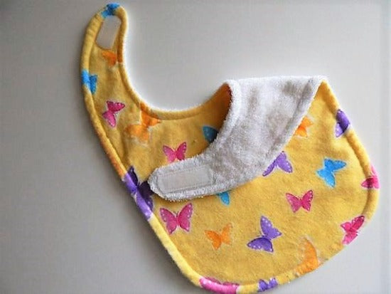 This bib and burp cloth set of butterflies with yellow background is made of flannel top and terry cloth backing, bib 9" from neck to bottom- 8" wide with sticky fasteners,  burp cloth is 16" x 8" to keep the baby dry from those frequent spills. Makes a great new mom gift, new born gift or baby shower gift.  Custom gift for a toddler - Borgmanns Creations - 2
