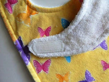 Load image into Gallery viewer, This bib and burp cloth set of butterflies with yellow background is made of flannel top and terry cloth backing, bib 9&quot; from neck to bottom- 8&quot; wide with sticky fasteners,  burp cloth is 16&quot; x 8&quot; to keep the baby dry from those frequent spills. Makes a great new mom gift, new born gift or baby shower gift.  Custom gift for a toddler - Borgmanns Creations - 3
