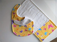 Load image into Gallery viewer, This bib and burp cloth set of butterflies with yellow background is made of flannel top and terry cloth backing, bib 9&quot; from neck to bottom- 8&quot; wide with sticky fasteners,  burp cloth is 16&quot; x 8&quot; to keep the baby dry from those frequent spills. Makes a great new mom gift, new born gift or baby shower gift.  Custom gift for a toddler - Borgmanns Creations - 5
