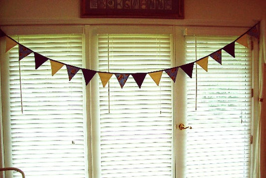 Fabric bunting banner party decoration and wonderful fabric banner for the nursery -  Flags are made of blue denim, cream denim, and blue and white checked cotton material with sunflowers - the flag section is 9' and hangs 6" down, there is 2 ft of blue bias tape on each side for tying - Borgmanns Creations - 1