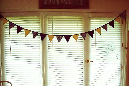 Fabric bunting banner party decoration and wonderful fabric banner for the nursery -  Flags are made of blue denim, cream denim, and blue and white checked cotton material with sunflowers - the flag section is 9' and hangs 6